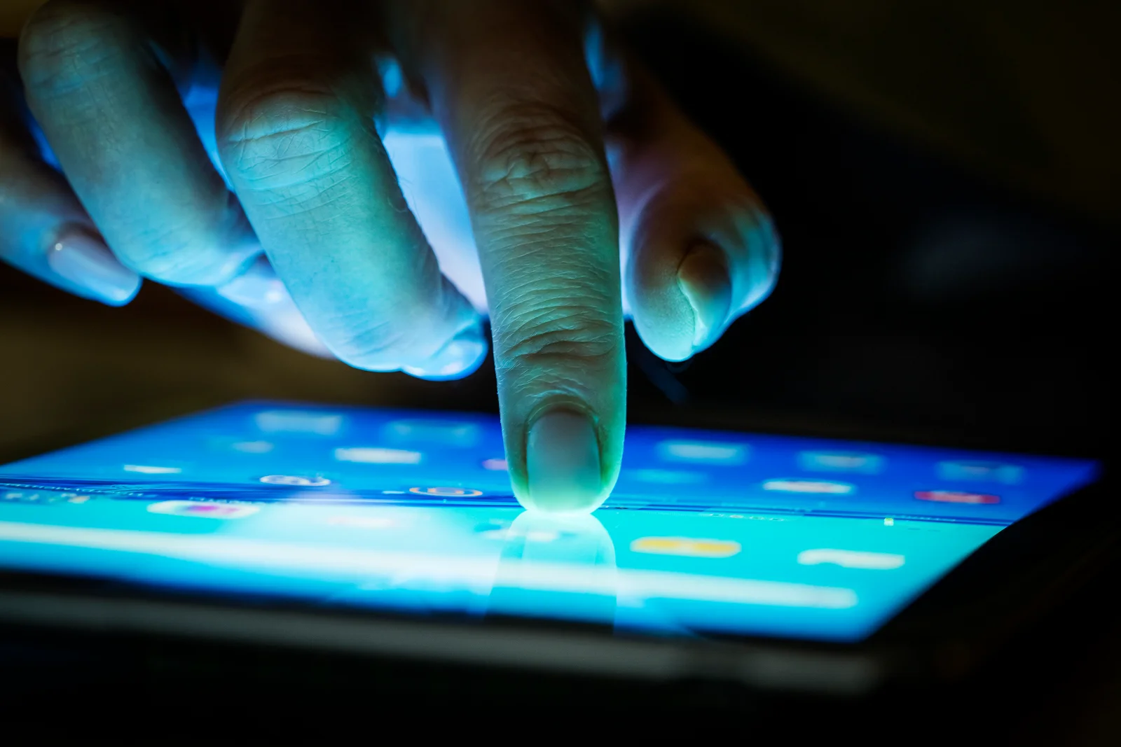 A finger interacting with a mobile application